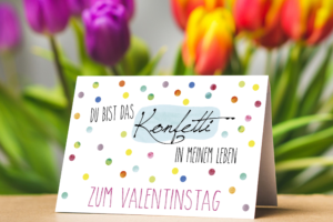 Moderne Valentinstagskarten mit bunten Punkte mit dem Text: Du bist das Konfetti in meinem Leben - Zum Valentinstag"